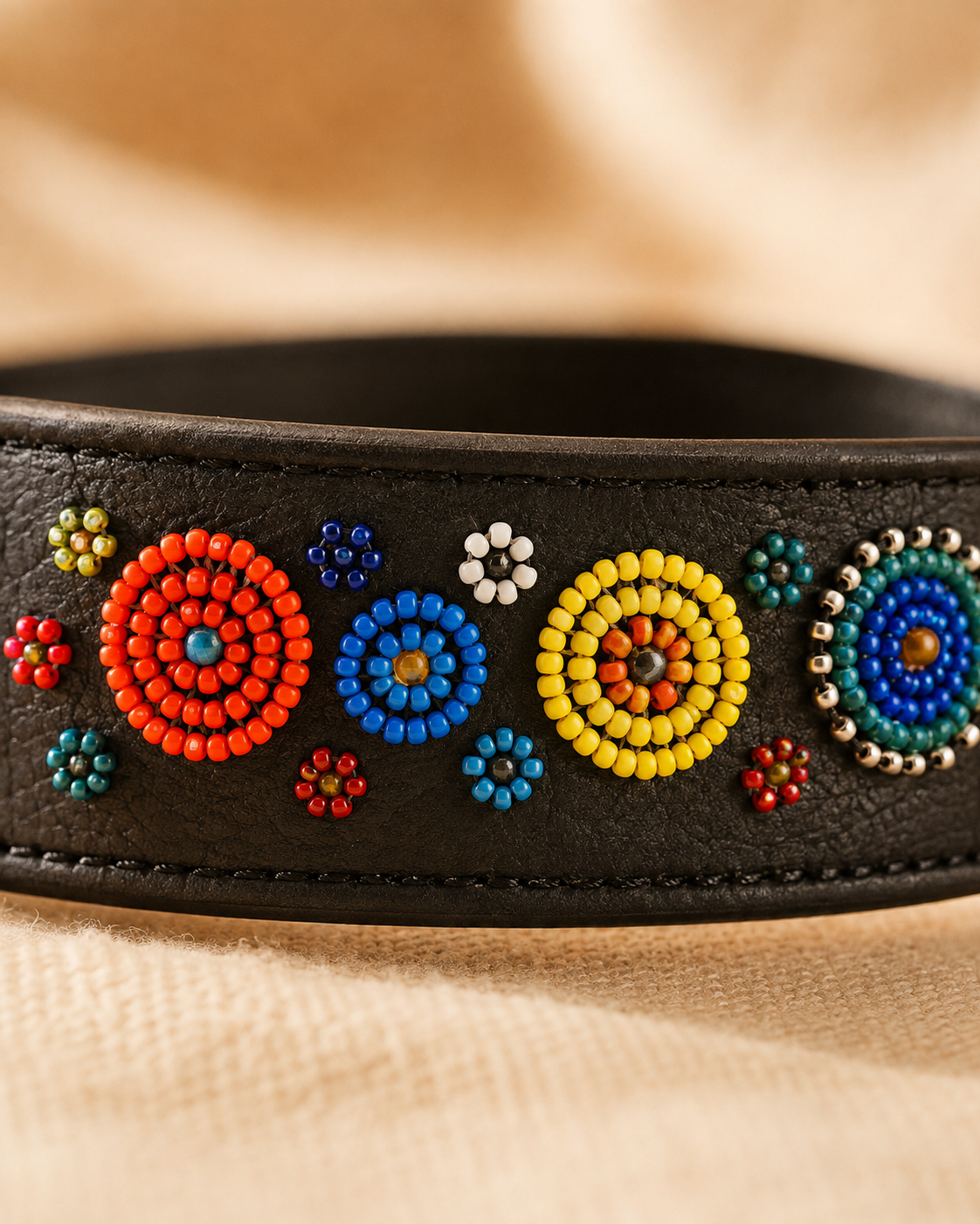 Macro close-up of multicolored floral Maasai beadwork on the Savanna Bloom leather dog collar